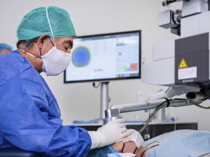 Surgeon performing an eye procedure using advanced laser technology