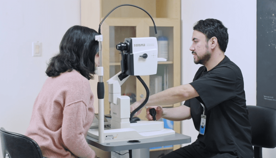 LASIK consultation with doctor performing eye exam